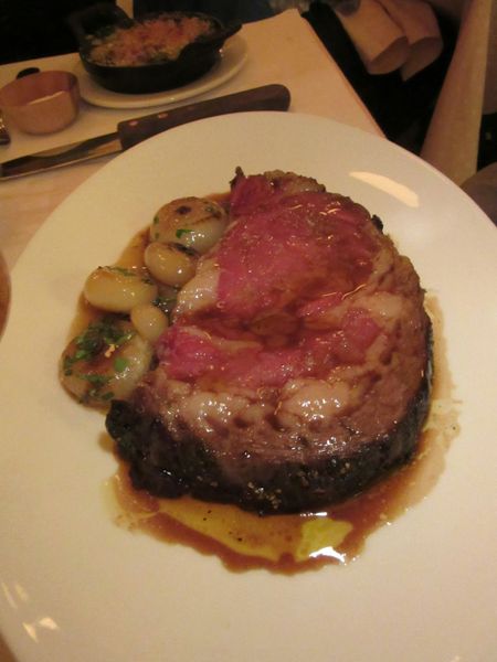 A carnivorean yen yields to dry-aged prime rib with cider braised onions and pommes soufflées.  