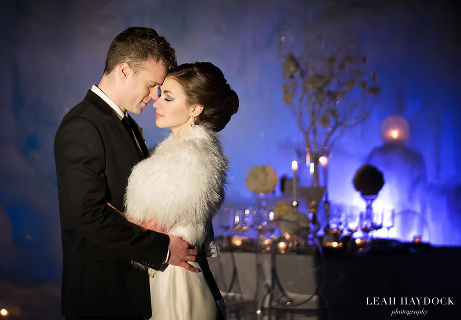 A bride and groom in an ice castle for a Narnia theme wedding in NH